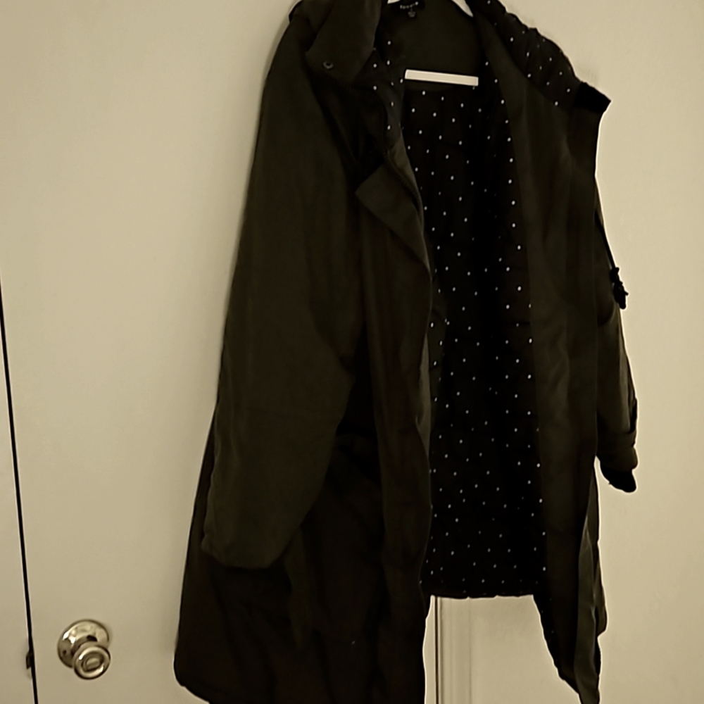 A down long - mid length army green winter coat. Slightly worn coat.